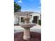 Close up of front fountain with home in the background at 26901 Racquet Cir, Leesburg, FL 34748