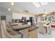 The kitchen features counter seating, stainless appliances, and ample counter space at 26901 Racquet Cir, Leesburg, FL 34748