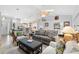 Bright living room featuring a vaulted ceiling, skylights, and stylish furnishings at 26901 Racquet Cir, Leesburg, FL 34748