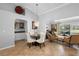 Open living space featuring a dining area and comfortable lounge seating at 26901 Racquet Cir, Leesburg, FL 34748