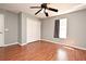 Bedroom features a closet, hardwood floors, ceiling fan, and a window providing natural light at 297 Sky Valley St, Clermont, FL 34711