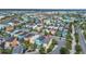 Aerial view of a colorful community with well-maintained homes and landscaping at 3083 Key Lime Loop, Kissimmee, FL 34747