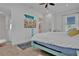 Well-lit bedroom featuring a comfortable bed, TV, and stylish décor at 3083 Key Lime Loop, Kissimmee, FL 34747