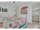 Well-lit bedroom featuring a comfortable bed, TV, and stylish décor at 3083 Key Lime Loop, Kissimmee, FL 34747