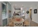 Inviting dining area with a view into the kitchen, featuring a round table at 3083 Key Lime Loop, Kissimmee, FL 34747