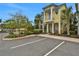 Beautiful two-story home exterior with a well-manicured lawn, lush landscaping, and ample parking at 3083 Key Lime Loop, Kissimmee, FL 34747
