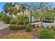 Beautiful home exterior showcasing lush landscaping, palm trees, and a well-maintained parking area at 3083 Key Lime Loop, Kissimmee, FL 34747