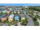 An aerial view showcasing colorful vacation homes with lush landscaping in a vibrant resort community at 3083 Key Lime Loop, Kissimmee, FL 34747