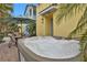 Relaxing hot tub with palm trees and outdoor seating, perfect for unwinding in style at 3083 Key Lime Loop, Kissimmee, FL 34747