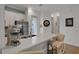 Modern kitchen with stainless steel appliances and white cabinetry, quartz countertops at 3083 Key Lime Loop, Kissimmee, FL 34747