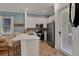 Efficient kitchen with stainless steel appliances and access to outdoor space at 3083 Key Lime Loop, Kissimmee, FL 34747