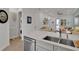 Open-concept kitchen with stainless appliances and a view into the living space at 3083 Key Lime Loop, Kissimmee, FL 34747
