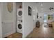 Conveniently located laundry room with stacked washer and dryer units at 3083 Key Lime Loop, Kissimmee, FL 34747