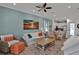 Bright and airy living room with a view of the kitchen and dining area at 3083 Key Lime Loop, Kissimmee, FL 34747
