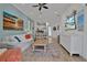 Inviting living room with an open floor plan that connects to the kitchen and dining area at 3083 Key Lime Loop, Kissimmee, FL 34747