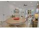 Open-concept living area with dining table, sofa, and stylish furnishings at 3083 Key Lime Loop, Kissimmee, FL 34747