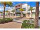 Exterior view of retail establishment with palm trees, stone facade, and inviting storefront under blue sky at 3083 Key Lime Loop, Kissimmee, FL 34747