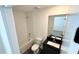 Bathroom featuring bathtub with tile surround, granite vanity, and modern fixtures at 3259 Energy Dr, Kissimmee, FL 34747