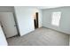 Bedroom with a window and neutral carpet flooring at 3259 Energy Dr, Kissimmee, FL 34747