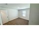 Cozy bedroom features plush carpeting and a bright window for natural light at 3259 Energy Dr, Kissimmee, FL 34747
