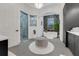 Elegant bathroom showcasing a glass-enclosed shower, freestanding tub, and stylish black vanity at 3382 Fernlake Pl, Longwood, FL 32779