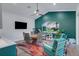 Bright dining area featuring a stylish round table, modern chairs, and a colorful accent rug at 3382 Fernlake Pl, Longwood, FL 32779