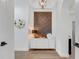 Elegant entryway with white wainscoting, stylish console, and modern light fixture at 3382 Fernlake Pl, Longwood, FL 32779