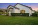 View of the house with a well-manicured lawn and manicured hedges, offering privacy and curb appeal at 3382 Fernlake Pl, Longwood, FL 32779