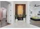 Foyer with decorative wall art and views into adjacent bedrooms, showcasing the home's layout at 3382 Fernlake Pl, Longwood, FL 32779