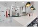 Open kitchen with island seating, stainless steel appliances, and a view of the pantry at 3382 Fernlake Pl, Longwood, FL 32779