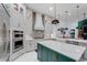 Modern kitchen featuring a spacious island, stainless steel appliances, and beautiful backsplash at 3382 Fernlake Pl, Longwood, FL 32779