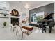 Open-concept living room features stylish furnishings, high ceilings, fireplace, and ample natural light at 3382 Fernlake Pl, Longwood, FL 32779