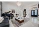 Well-lit living room featuring stylish decor, piano, modern furnishings, and elegant details at 3382 Fernlake Pl, Longwood, FL 32779