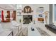 Bright and stylish living room showcasing a fireplace, modern decor, and a comfortable seating area at 3382 Fernlake Pl, Longwood, FL 32779