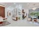 Spacious living space with an open floor plan, bright tile flooring, and modern decor elements at 3382 Fernlake Pl, Longwood, FL 32779