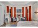 Intimate sitting area in a main bedroom with bay window and privacy shutters at 3382 Fernlake Pl, Longwood, FL 32779