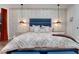 Cozy main bedroom featuring a plush bed, stylish lighting, and elegant décor at 3382 Fernlake Pl, Longwood, FL 32779