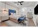 Bright and spacious main bedroom with patterned wallpaper and modern furnishings at 3382 Fernlake Pl, Longwood, FL 32779
