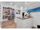 Large walk-in closet with custom organizers, granite countertop, and open shelving at 3382 Fernlake Pl, Longwood, FL 32779