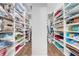 Spacious walk-in closet featuring custom shelving with ample storage space for linens and personal items at 3382 Fernlake Pl, Longwood, FL 32779