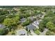 Expansive aerial view of the neighborhood, showcasing lush greenery, a nearby golf course, and upscale residences at 3514 Golfview Blvd, Orlando, FL 32804