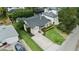 Lovely aerial view of a landscaped home with a long driveway, a manicured lawn, and other well-kept homes nearby at 3514 Golfview Blvd, Orlando, FL 32804