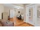 Cozy bedroom with hardwood floors, ceiling fan, and double doors leading to the outside at 3514 Golfview Blvd, Orlando, FL 32804