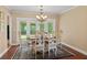 Formal dining room with elegant chandelier and french doors at 3514 Golfview Blvd, Orlando, FL 32804