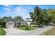Well-maintained home with mature trees, nice landscaping, a manicured lawn, and a two-car garage at 3514 Golfview Blvd, Orlando, FL 32804