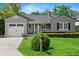 Charming home with manicured lawn, mailbox, front-facing garage, and a welcoming front porch at 3514 Golfview Blvd, Orlando, FL 32804