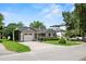 Charming home featuring manicured front lawn, mature trees, and a driveway at 3514 Golfview Blvd, Orlando, FL 32804