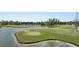 Picture perfect view of a lush golf course with water features, providing a serene and scenic backdrop at 3514 Golfview Blvd, Orlando, FL 32804