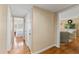 Hallway leading to a bright bedroom and an open view of the living room at 3514 Golfview Blvd, Orlando, FL 32804