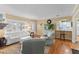 Inviting living room features hardwood floors, neutral paint, and a view into the kitchen at 3514 Golfview Blvd, Orlando, FL 32804